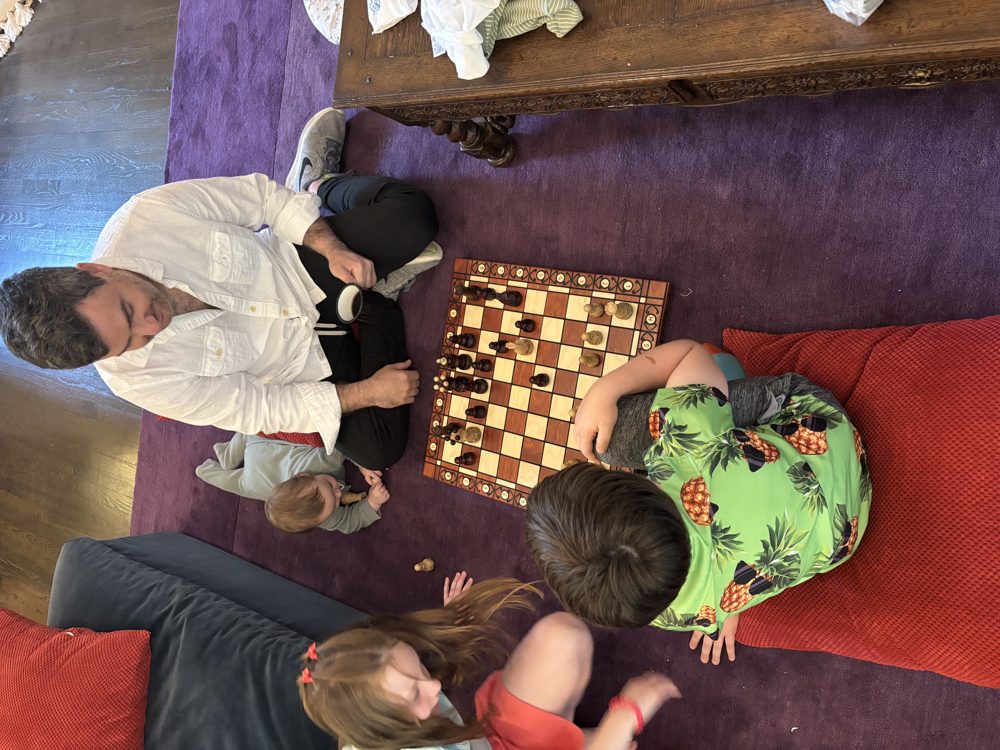 Chess on the living room rug with the kids